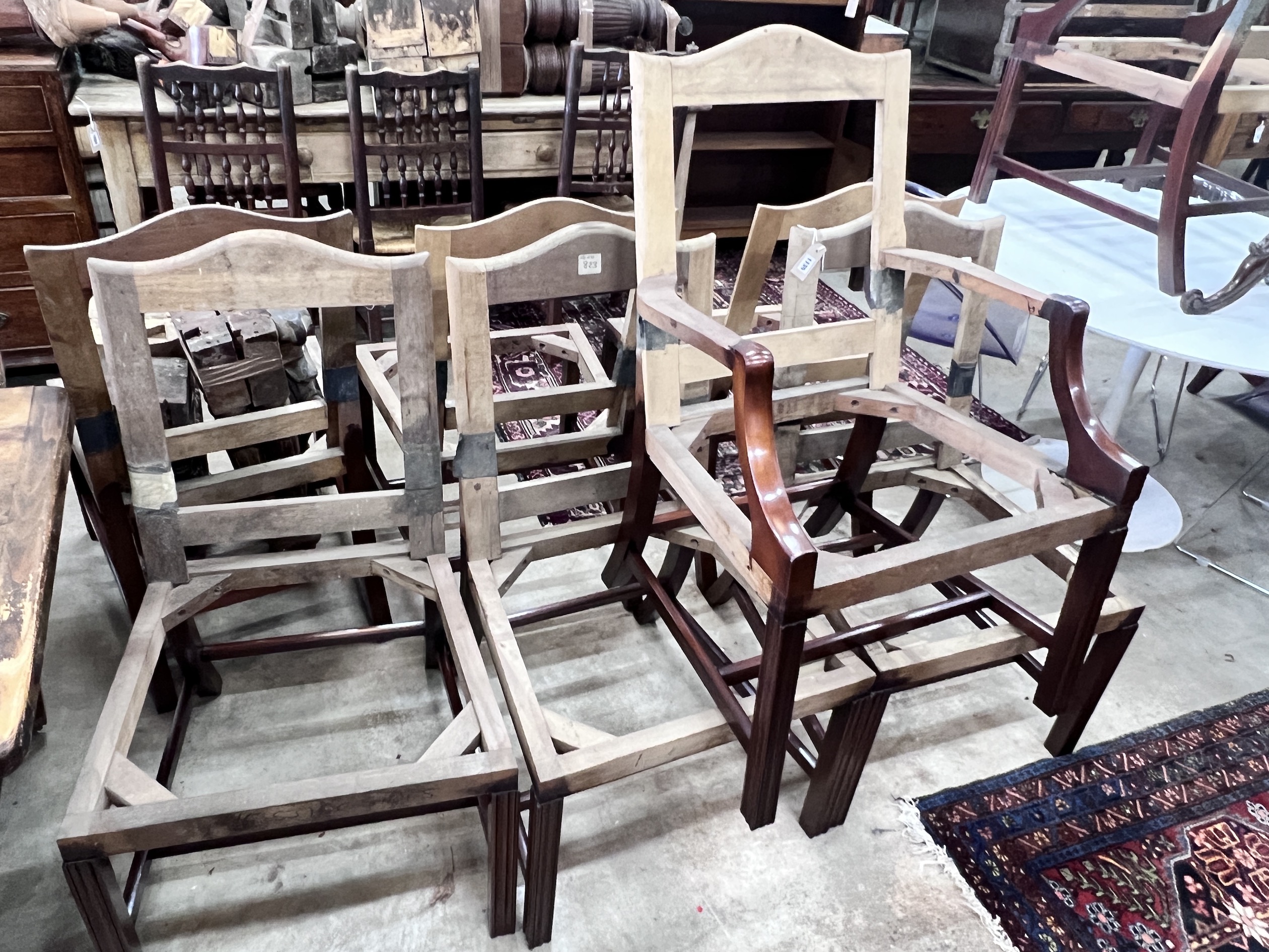 A set of eight George III style mahogany chair frames (6 + 2 carvers)